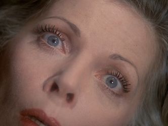 An extreme closeup of Barbara's face. She is beyond startled.