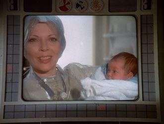 Barbara is wearing a lot of cling film this month, apparently because she has just delivered a baby. And here she is on the screen in Main Mission, smiling happily while the baby looks across at her with suspicion.