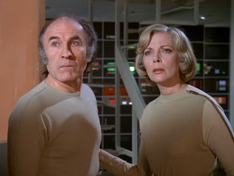 Victor and Helena, standing together in Main Mission for the last time.